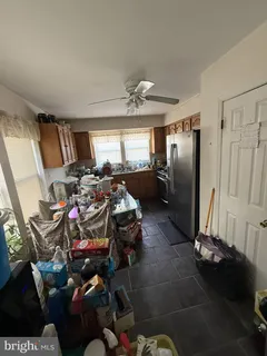 a kitchen with stainless steel appliances granite countertop a stove a microwave and a refrigerator