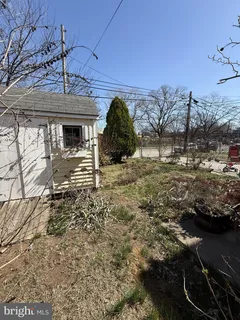 a house view with a backyard space
