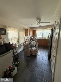 a kitchen with sink refrigerator and stove