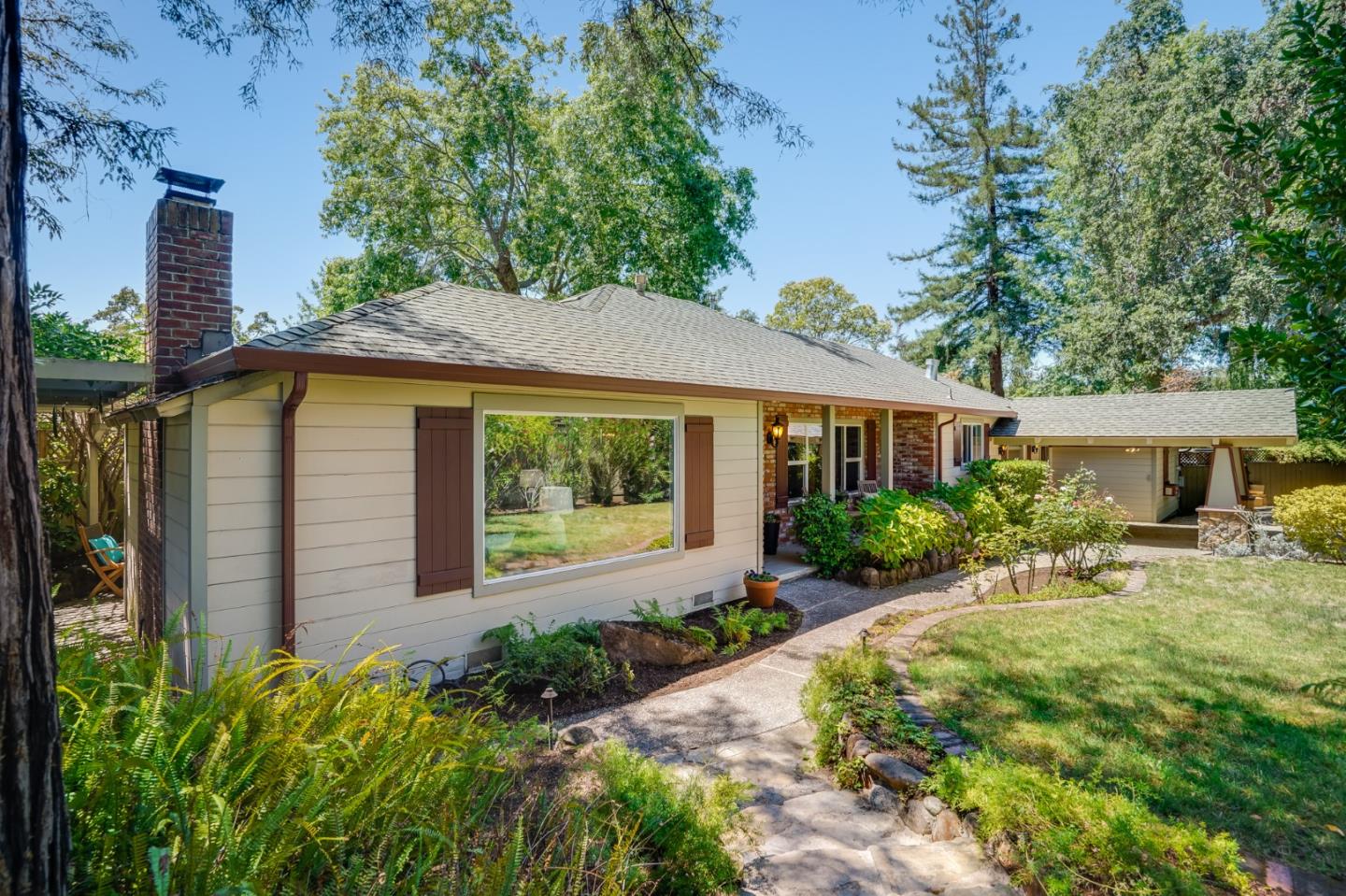 a front view of a house with garden