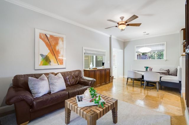 a bedroom with bed and a chandelier