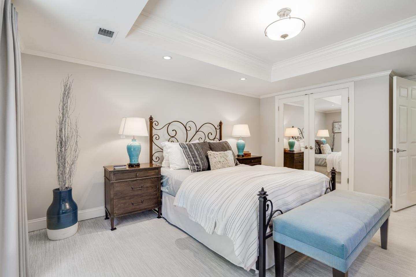 1990 Sharon Road Menlo Park, CA 94025 - Photo 20 of 40 a bedroom with bed and a chandelier