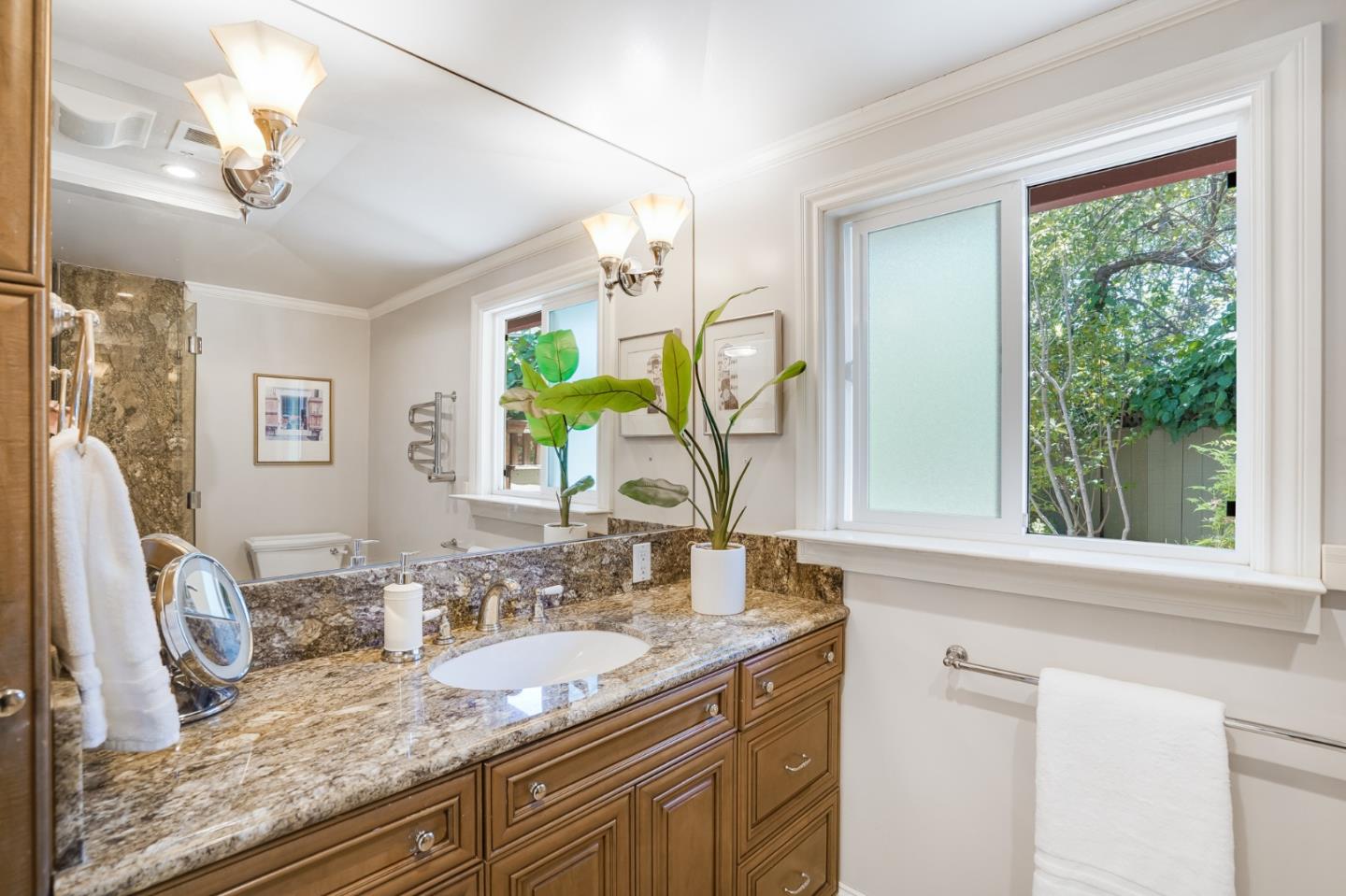 1990 Sharon Road Menlo Park, CA 94025 - Photo 24 of 40 a bathroom with a granite countertop sink and a mirror