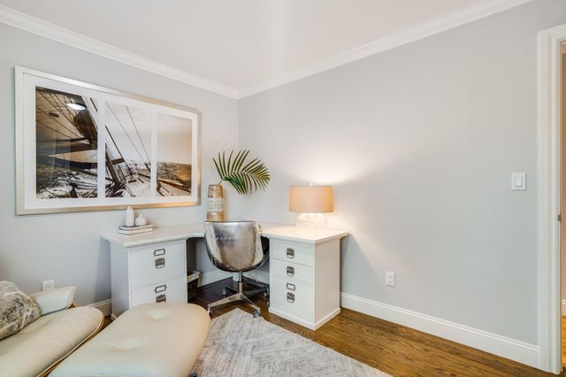 a bedroom with a bed and a chair