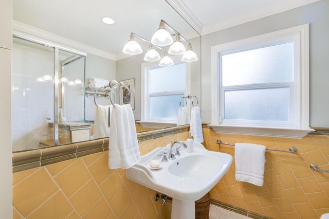 a view of a patio with table and chairs and potted plants