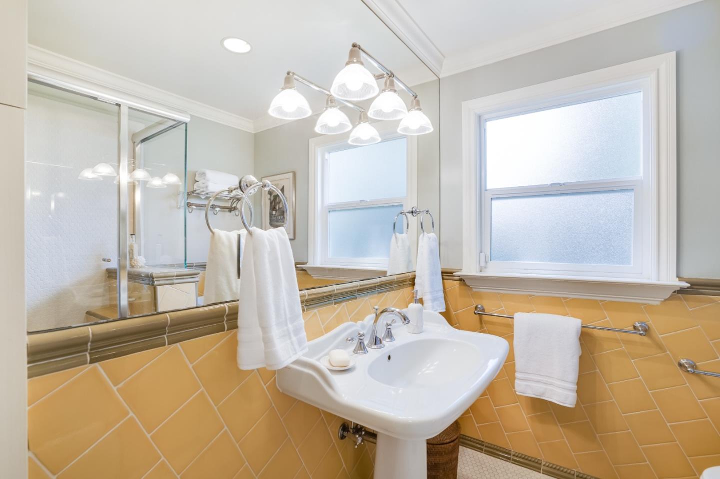 1990 Sharon Road Menlo Park, CA 94025 - Photo 31 of 40 a bathroom with a sink a tub and a mirror