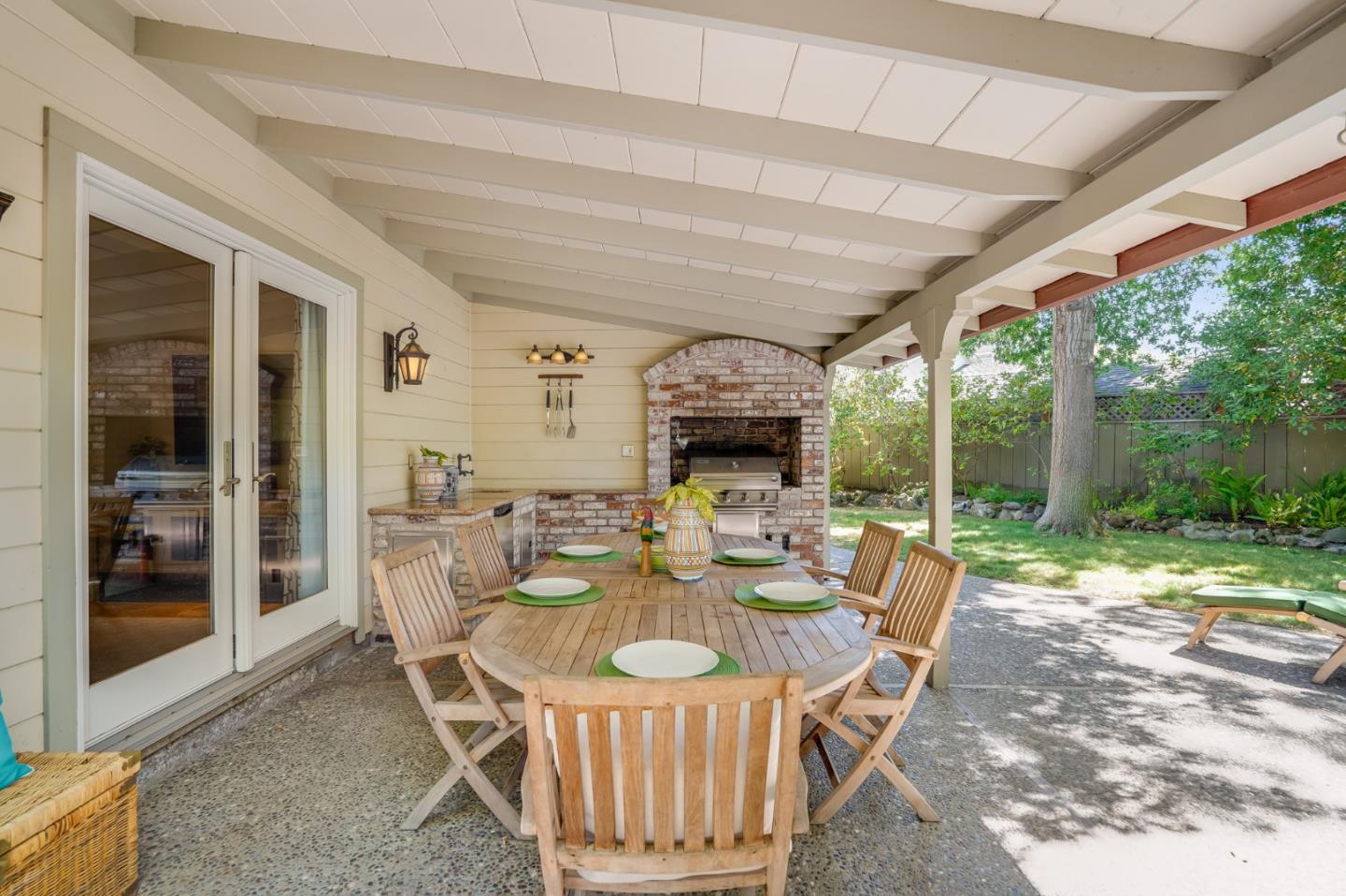 1990 Sharon Road Menlo Park, CA 94025 - Photo 39 of 40 a dining room with furniture a garden and patio