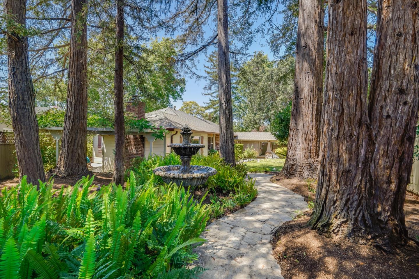 1990 Sharon Road Menlo Park, CA 94025 - Photo 4 of 40 a front view of a house with garden