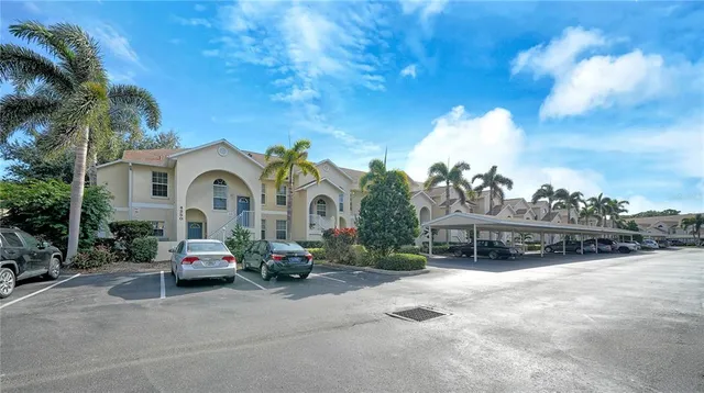 a view of a patio with table and chairs and potted plants