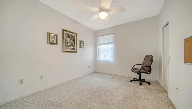 a view of workspace with a window and gym equipment