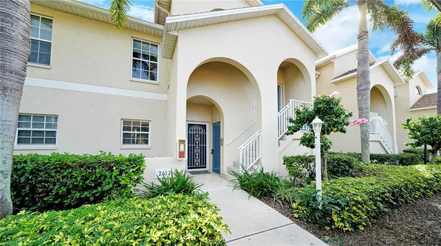 a front view of a house with lots of garden