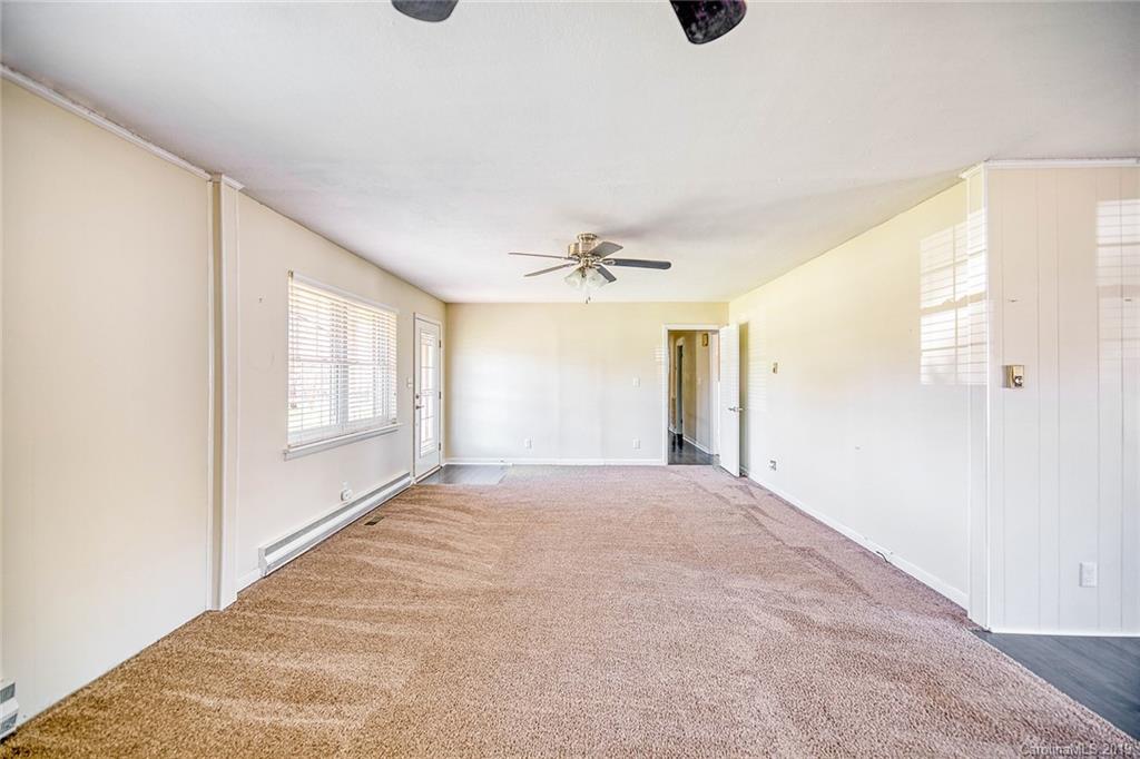 12001 Idlewild Road, Unit 7 Matthews, NC 28105 - Photo 13 of 29 a view of an empty room and window