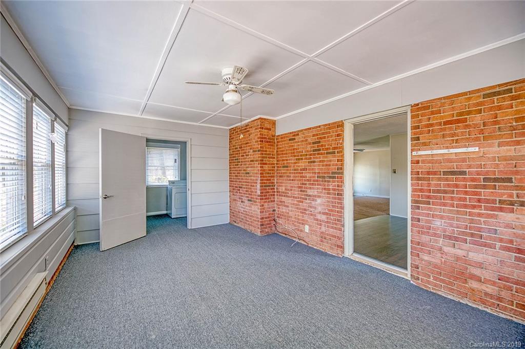 12001 Idlewild Road, Unit 7 Matthews, NC 28105 - Photo 14 of 29 a view of empty room with windows