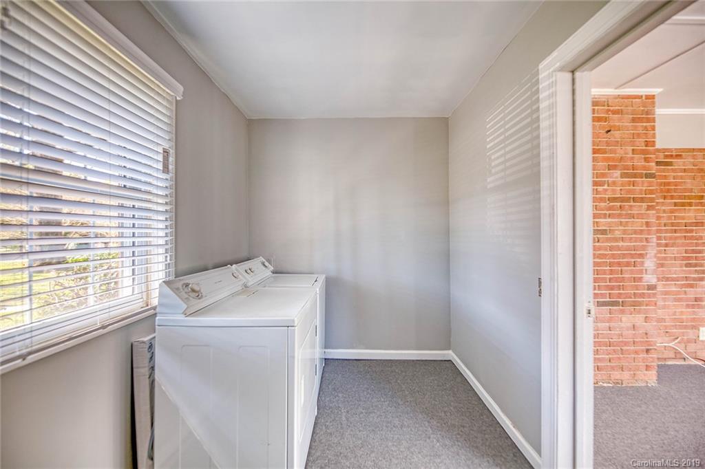 12001 Idlewild Road, Unit 7 Matthews, NC 28105 - Photo 15 of 29 a utility room with dryer and washer