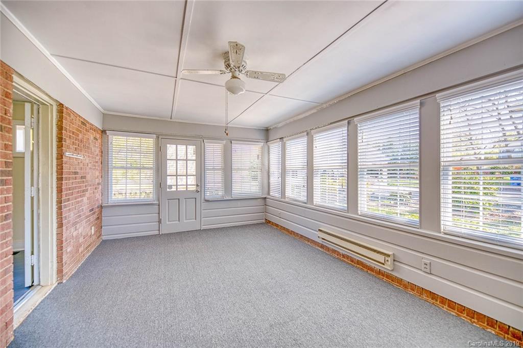 12001 Idlewild Road, Unit 7 Matthews, NC 28105 - Photo 16 of 29 a view of room with window and furniture