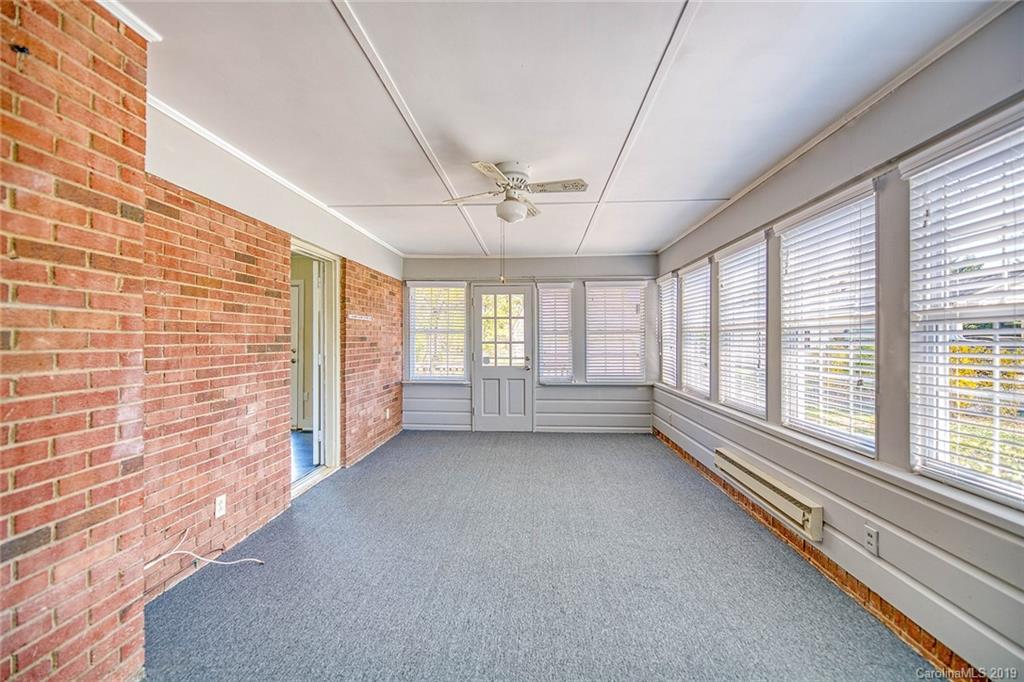 12001 Idlewild Road, Unit 7 Matthews, NC 28105 - Photo 17 of 29 a view of an empty room with a window