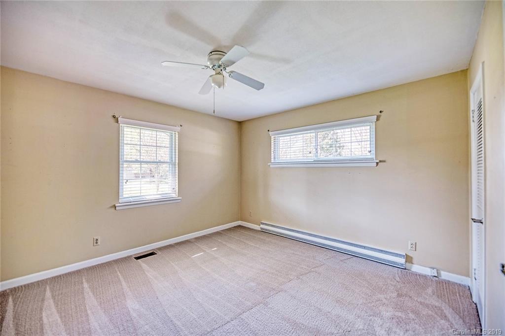 12001 Idlewild Road, Unit 7 Matthews, NC 28105 - Photo 21 of 29 a view of an empty room with a window