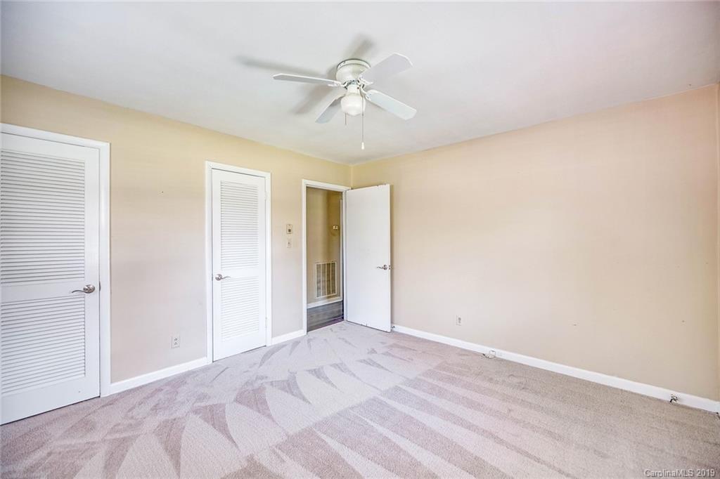 12001 Idlewild Road, Unit 7 Matthews, NC 28105 - Photo 23 of 29 a view of a room with a ceiling fan