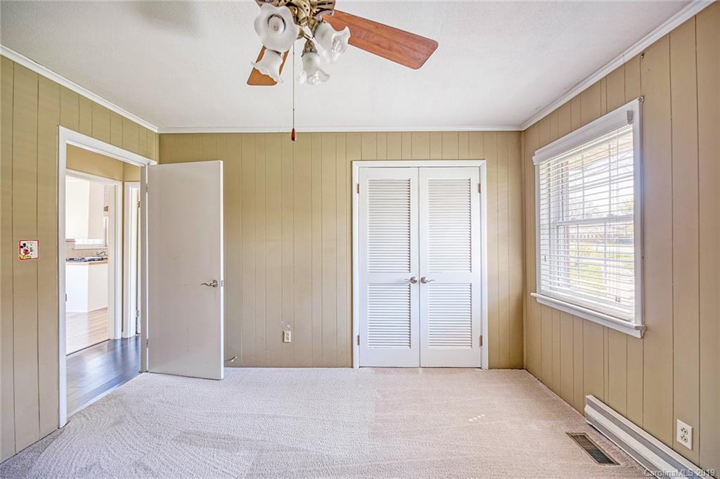 12001 Idlewild Road, Unit 7 Matthews, NC 28105 - Photo 24 of 29 a view of an empty room with a window