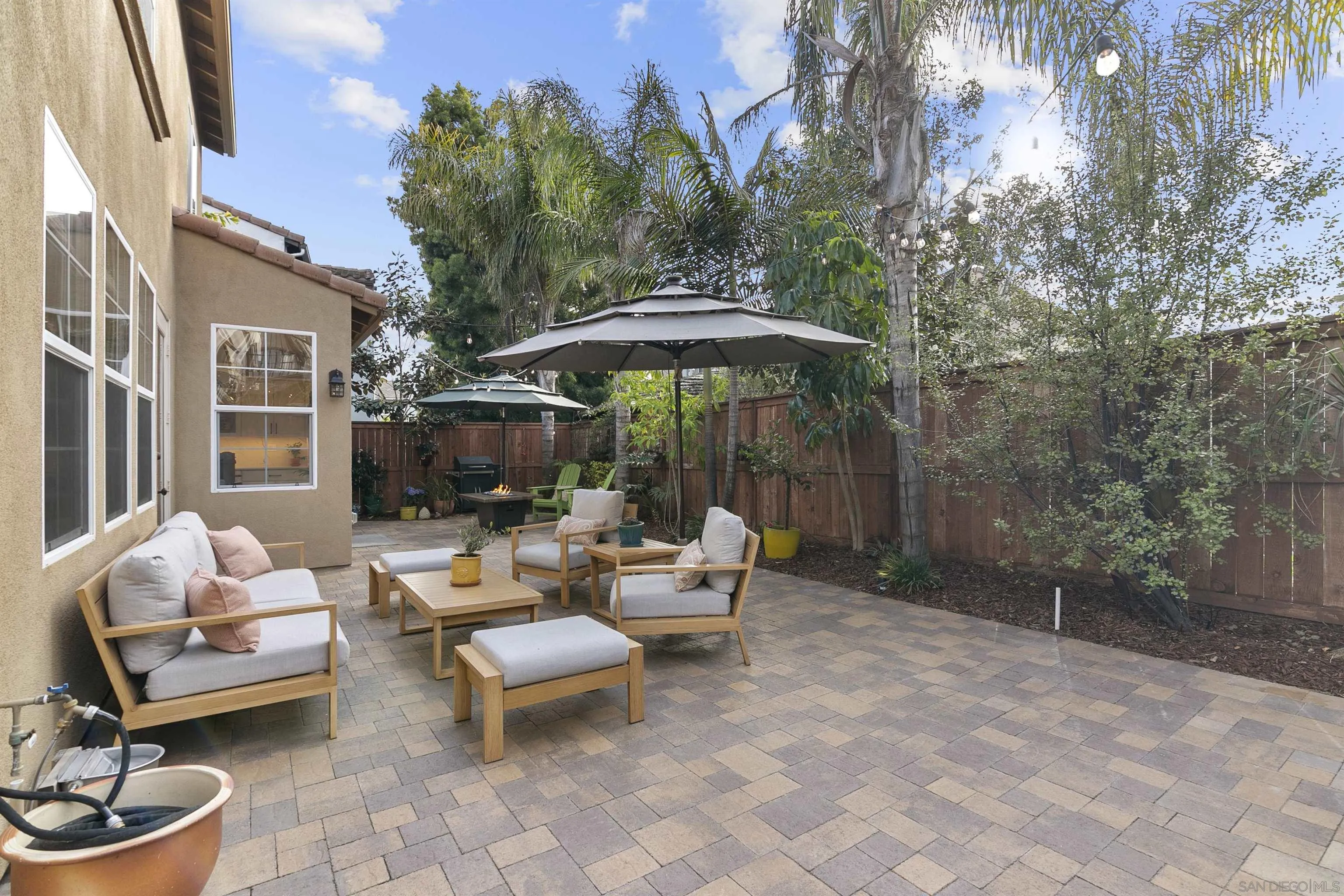 7451 Capstan Drive Carlsbad, CA 92011 - Photo 33 of 64 a outdoor space with the patio couches and a potted plant