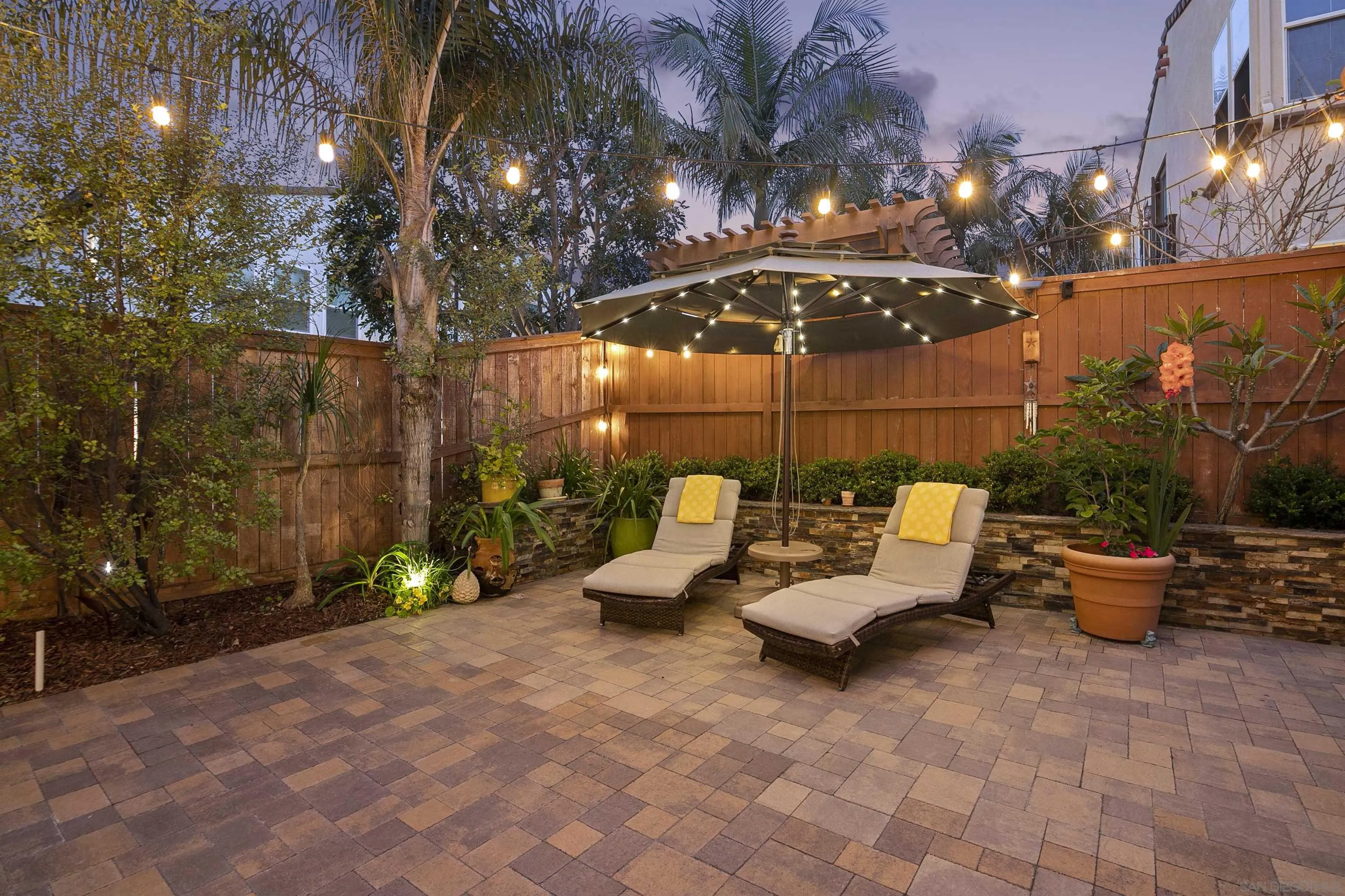 7451 Capstan Drive Carlsbad, CA 92011 - Photo 52 of 64 a view of a patio with couches and potted plants
