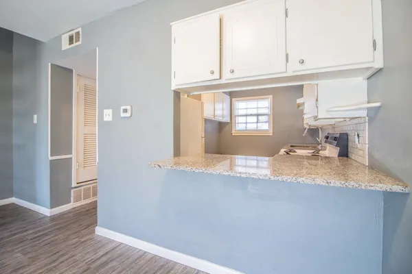 a view of a kitchen with marble kitchen and entryway