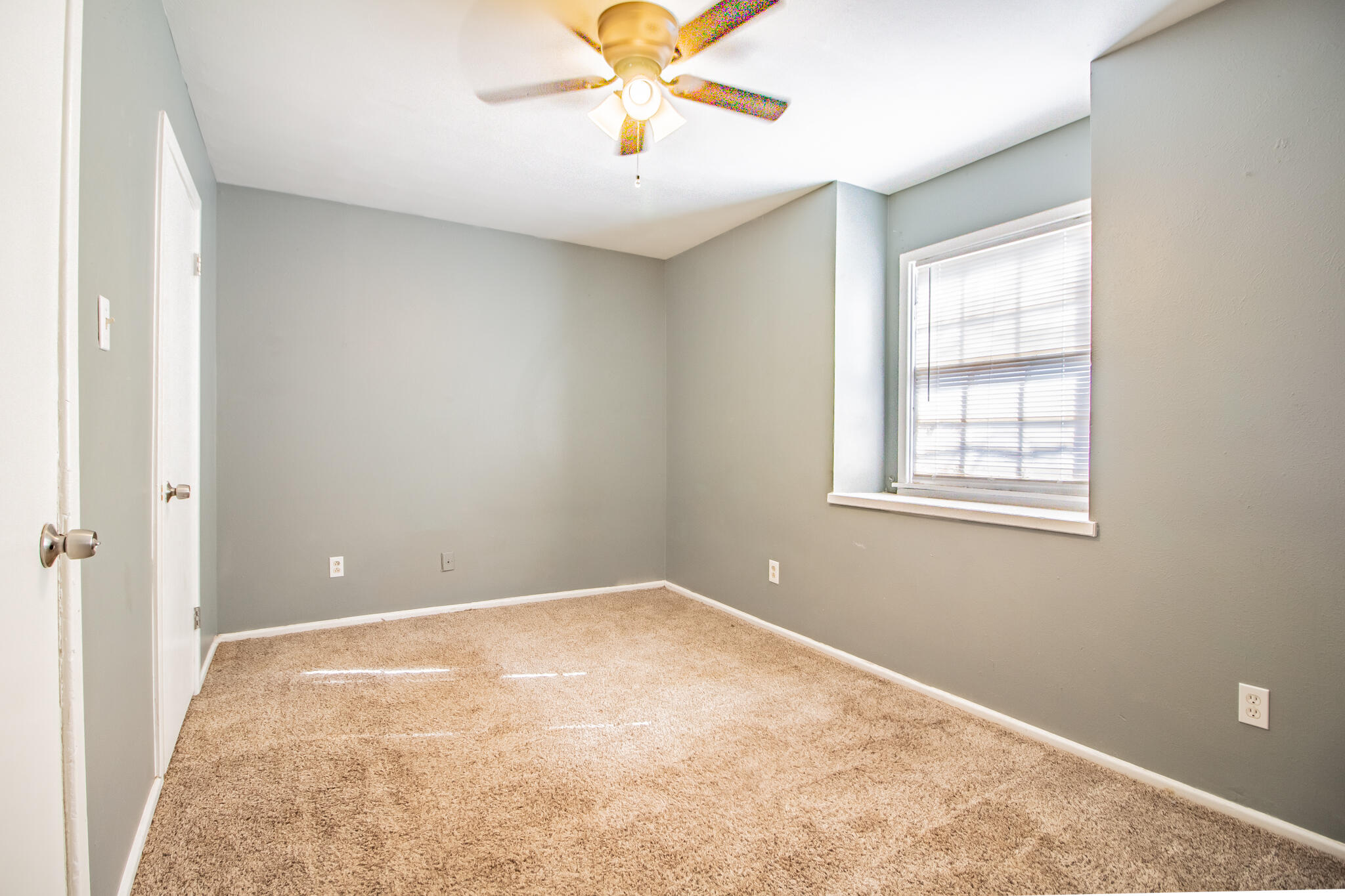 2101 49th Street Lubbock, TX 79412 - Photo 26 of 31 wooden floor in an empty room with a window