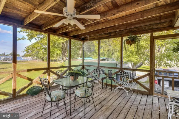 a view of a swimming pool with outdoor seating