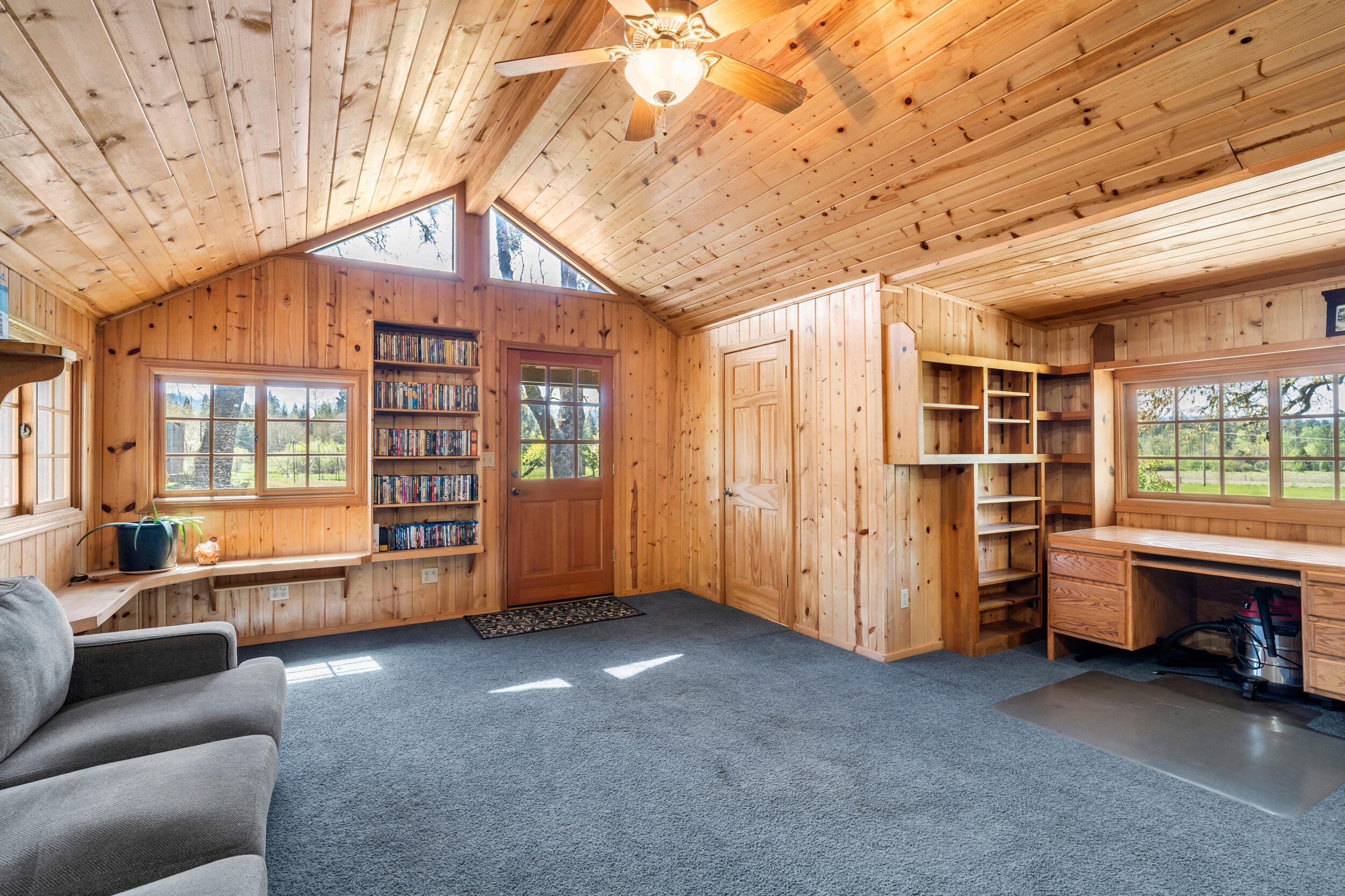 7589 Takilma Road Cave Junction, OR 97523 - Photo 17 of 54 a view of livingroom with furniture and windows