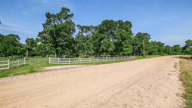 a view of a swimming pool with a yard