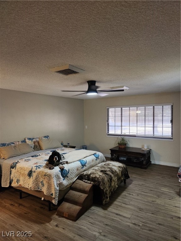 2645 South Lindell Road Las Vegas, NV 89146 - Photo 14 of 30 Primary Bedroom featuring wood finished floors, a textured ceiling, and ceiling fan