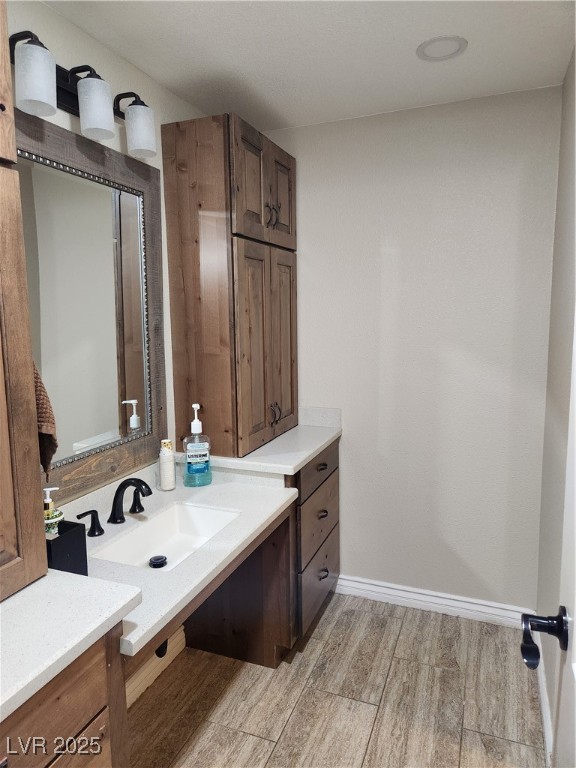 2645 South Lindell Road Las Vegas, NV 89146 - Photo 23 of 30 Bathroom with wood finished floors and vanity