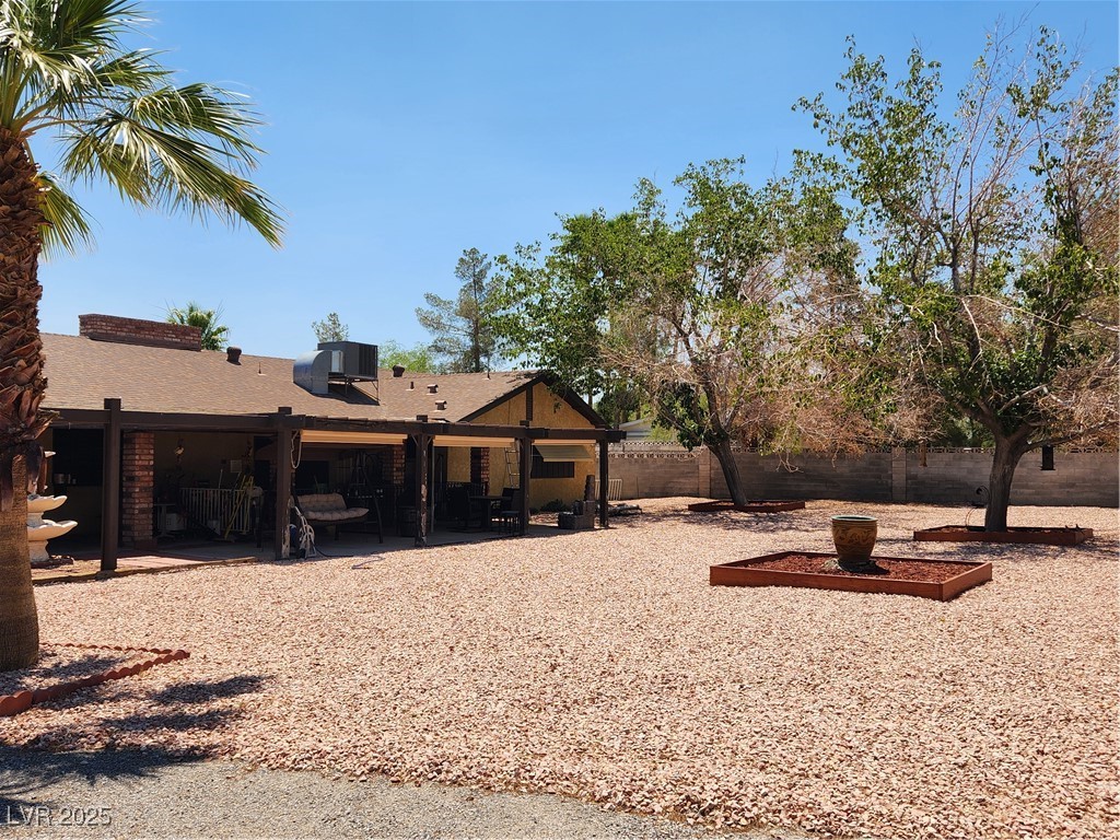 2645 South Lindell Road Las Vegas, NV 89146 - Photo 25 of 30 Rear view of house with a patio area