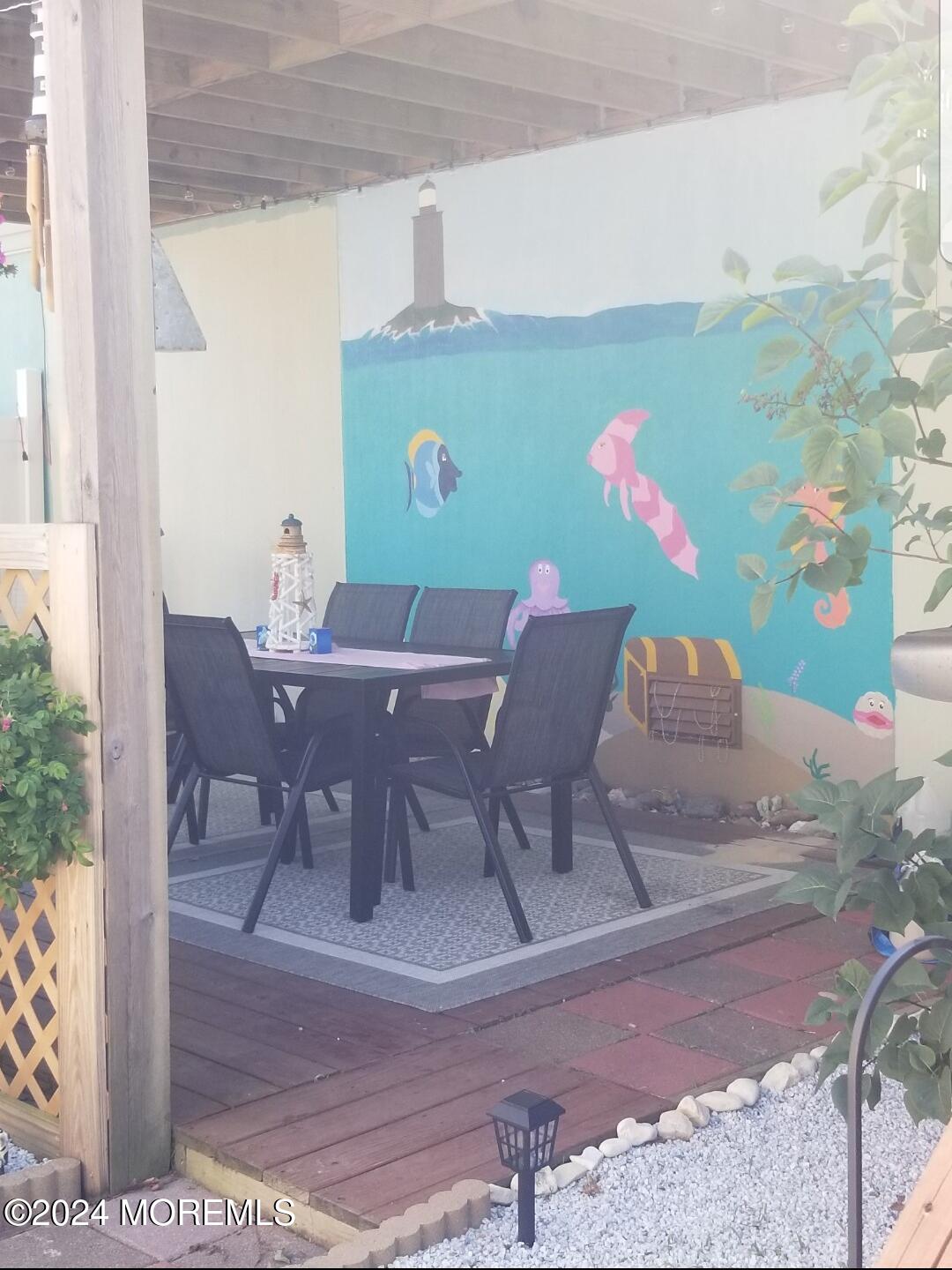 334 Bayview Avenue Ocean Gate, NJ 08740 - Photo 29 of 69 a view of a dining room with furniture and wooden floor