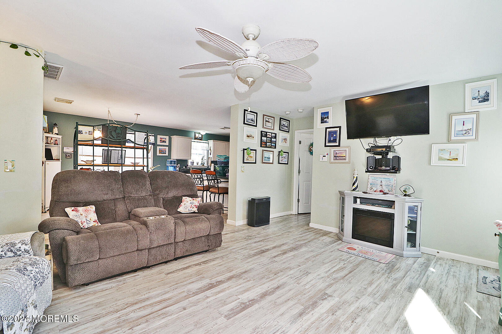 334 Bayview Avenue Ocean Gate, NJ 08740 - Photo 34 of 69 a living room with furniture and a flat screen tv