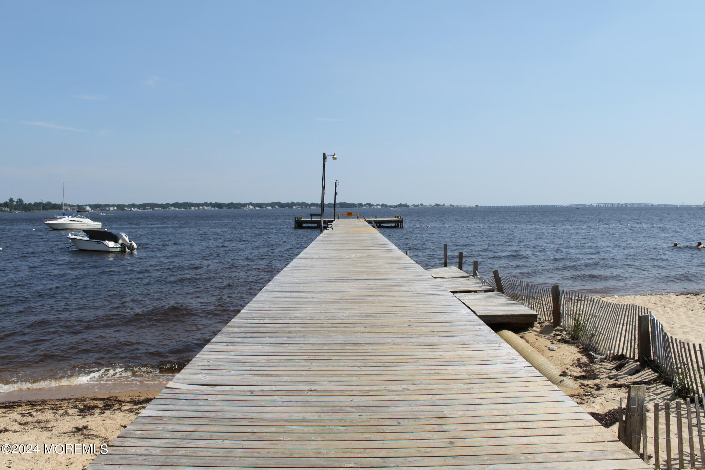 334 Bayview Avenue Ocean Gate, NJ 08740 - Photo 61 of 69 a view of roof deck with two chairs and wooden floor