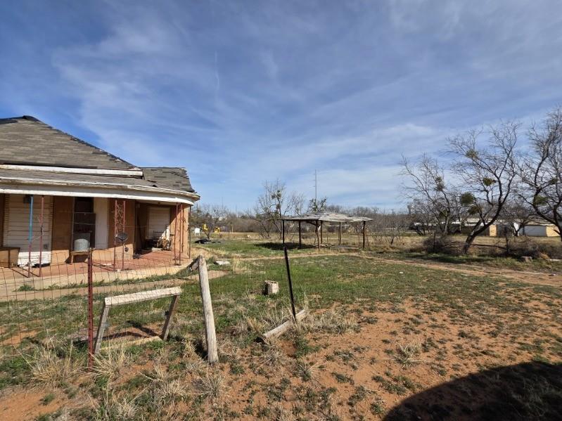801 Haskell Street Sweetwater, TX 79556 - Photo 7 of 9 a backyard of a house with table and chairs