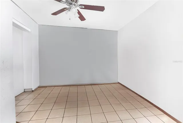 a view of an empty room and wooden floor