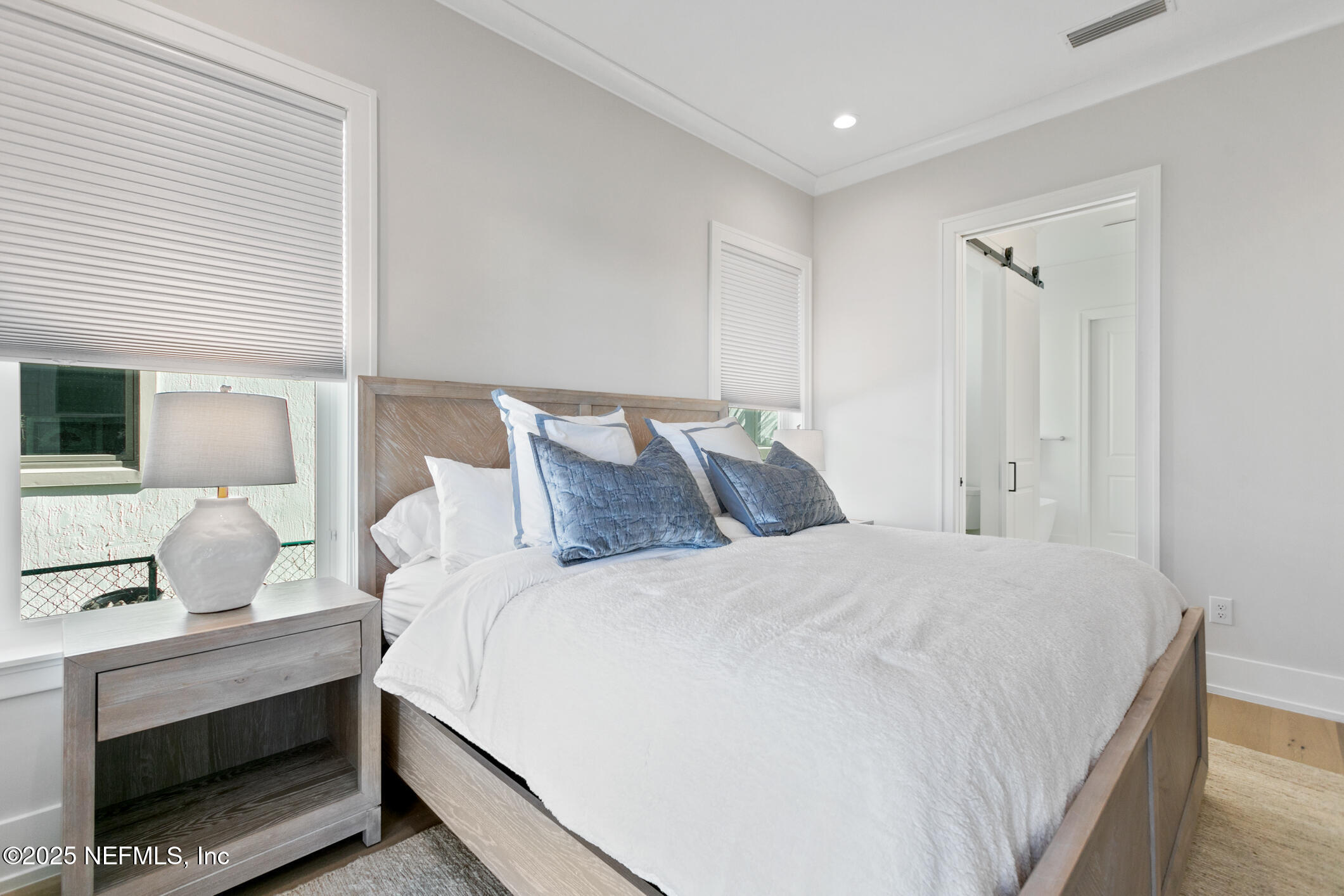55 A Solana Road Ponte Vedra Beach, FL 32082 - Photo 21 of 42 a large white bed in a white room