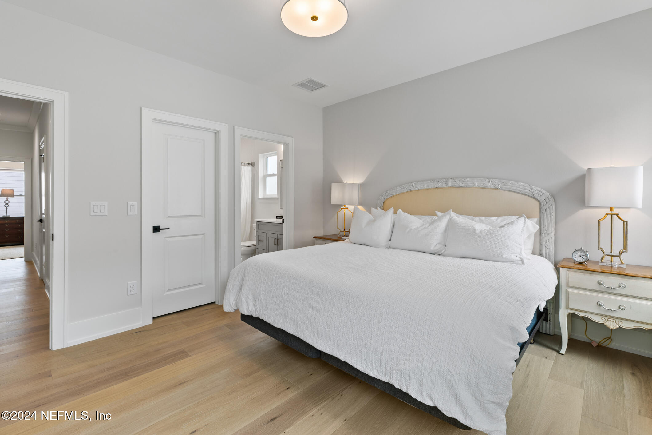 55 A Solana Road Ponte Vedra Beach, FL 32082 - Photo 27 of 42 a bedroom with a bed and wooden floor