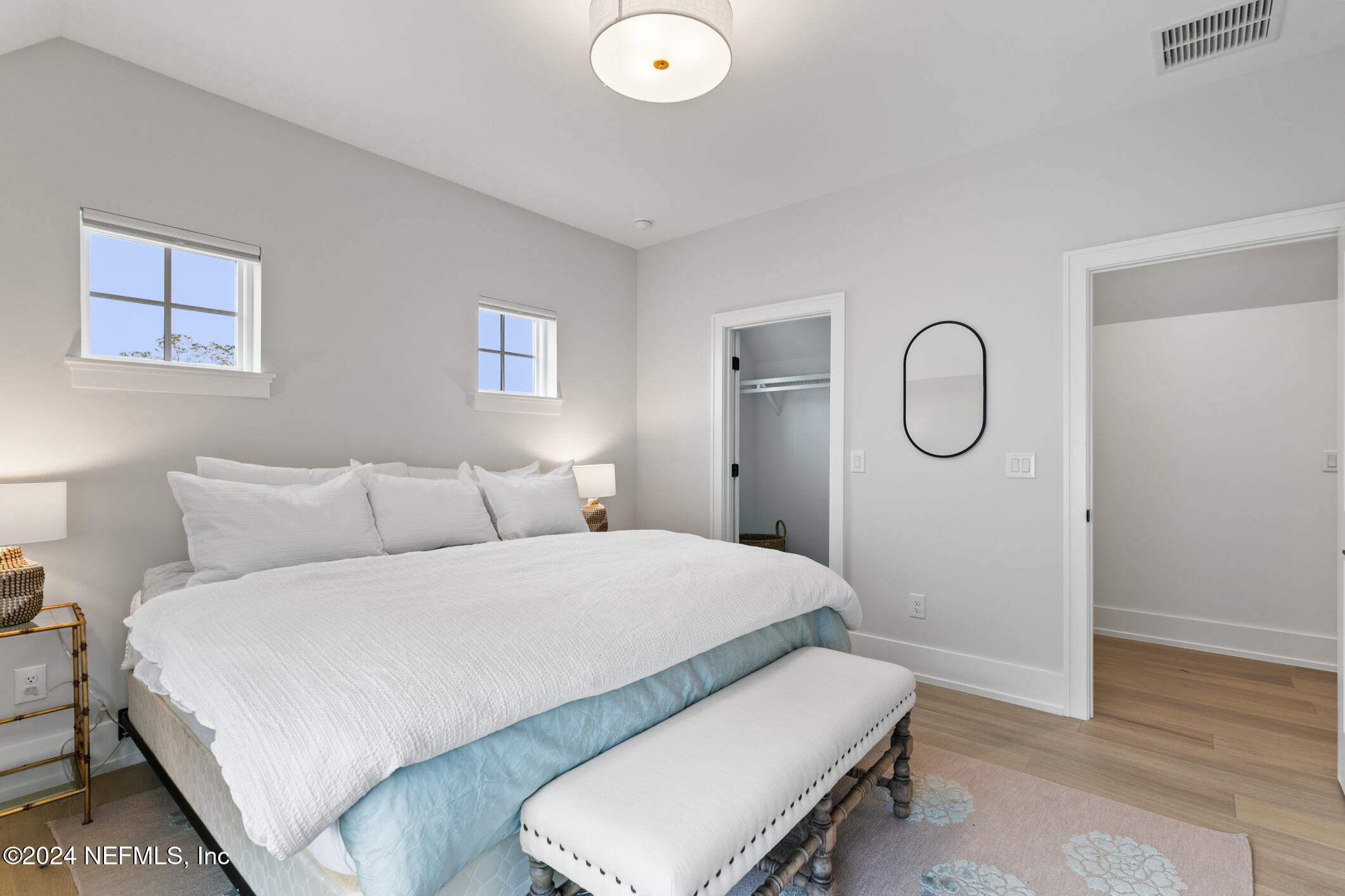 55 A Solana Road Ponte Vedra Beach, FL 32082 - Photo 30 of 42 a room with a bed mirror and window