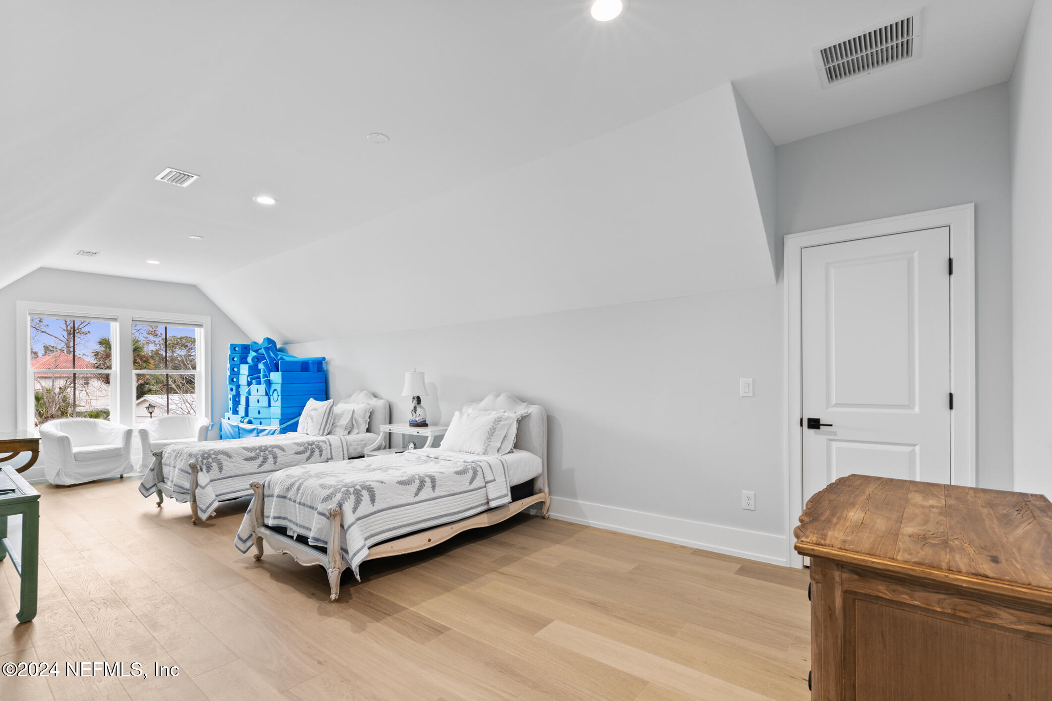 55 A Solana Road Ponte Vedra Beach, FL 32082 - Photo 31 of 42 a bedroom with a bed and a couch