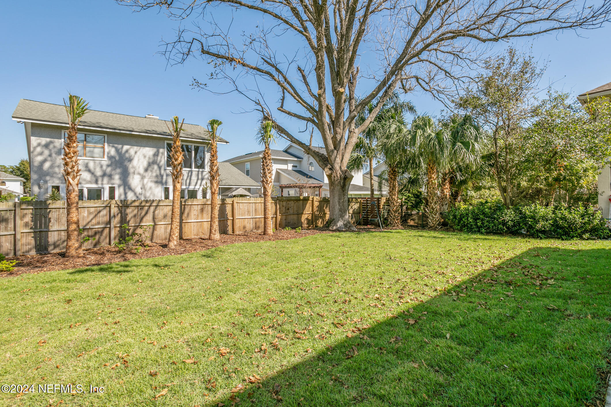 55 A Solana Road Ponte Vedra Beach, FL 32082 - Photo 38 of 42 a view of a yard with a house