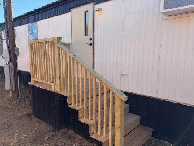 110 County Road Brookston, TX 75421 - Photo 12 of 14 a view of staircase with railing and white walls