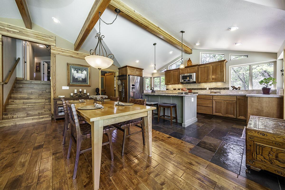 7785 Old Stage Road Central Point, OR 97502 - Photo 2 of 47 a open kitchen with a table and chairs in it