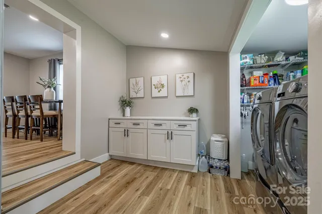 a view of a hallway with washer and dryer