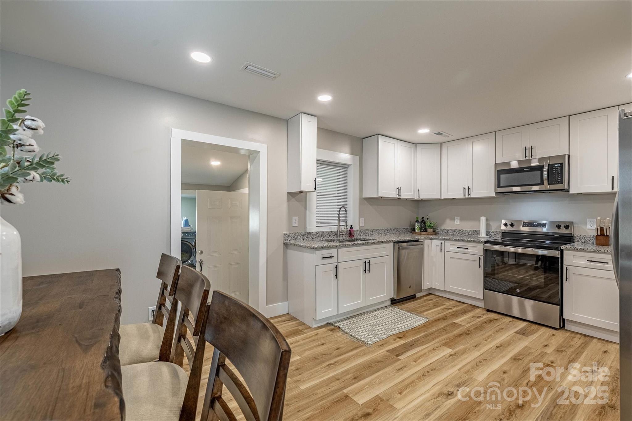 2625 20th St Lane Northeast Hickory, NC 28601 - Photo 14 of 31 a kitchen with stainless steel appliances granite countertop a refrigerator sink and stove