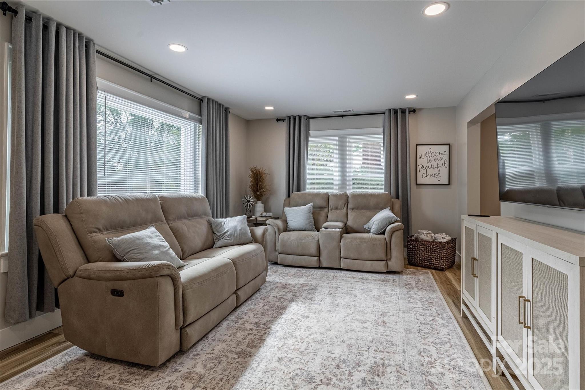 2625 20th St Lane Northeast Hickory, NC 28601 - Photo 16 of 31 a living room with furniture and a flat screen tv