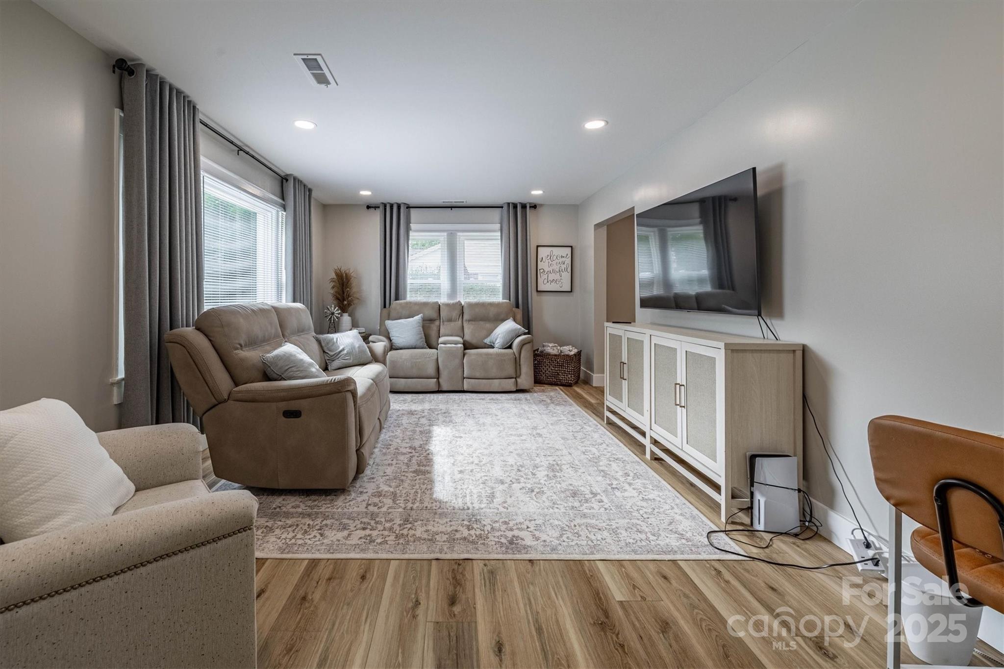 2625 20th St Lane Northeast Hickory, NC 28601 - Photo 17 of 31 a living room with furniture and a flat screen tv