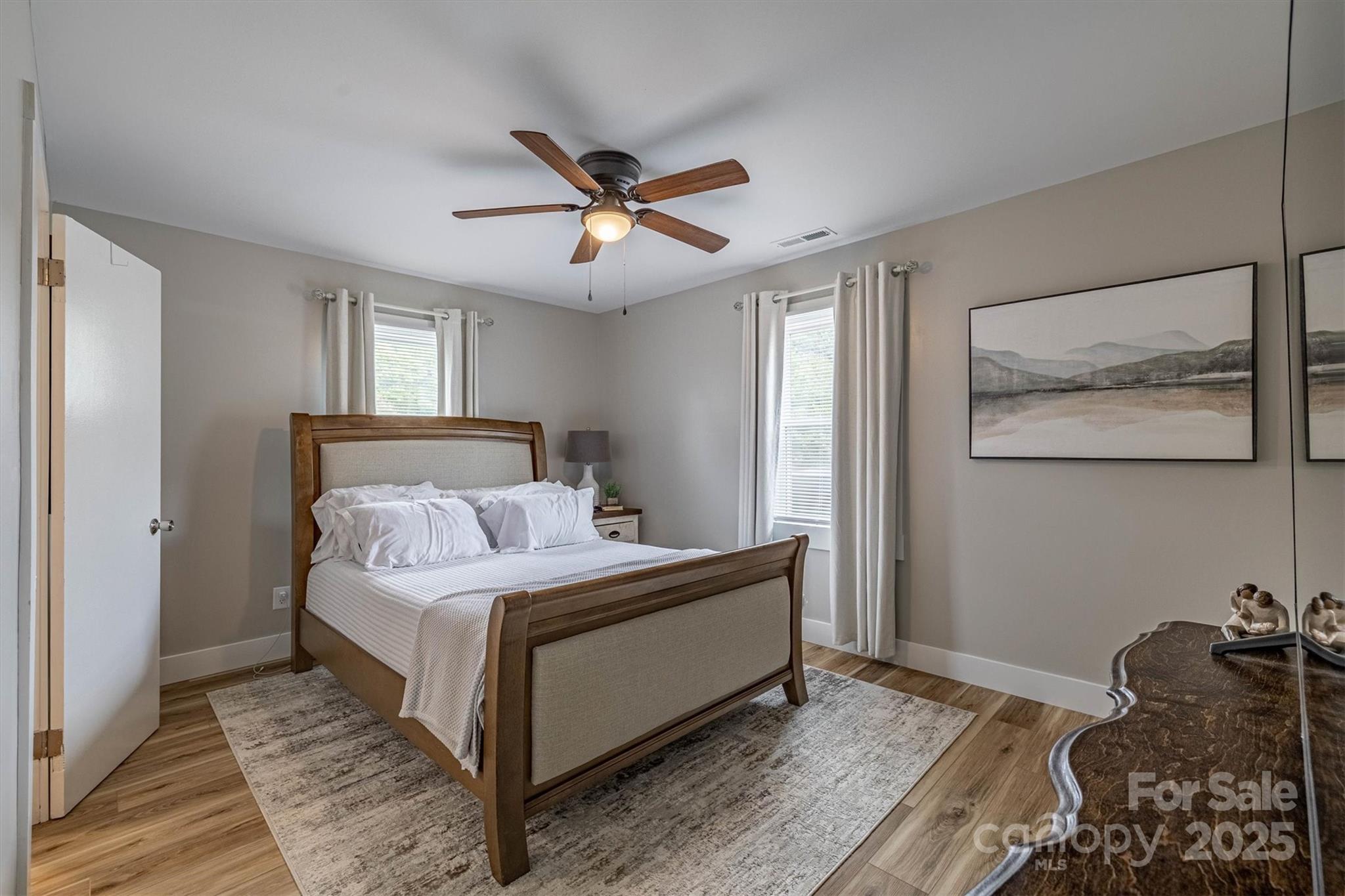 2625 20th St Lane Northeast Hickory, NC 28601 - Photo 26 of 31 a bedroom with a bed and wooden floor
